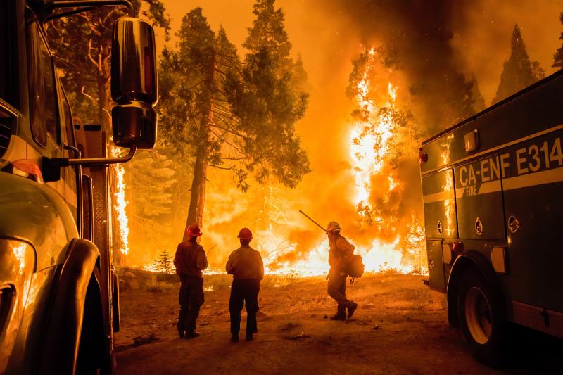 Crews set a backfire in an effort to gain control of the massive Caldor fire near the Tahoe basin in California on Aug. 26. Crews set a backfire in an effort to gain control of the massive Caldor fire near the Tahoe basin in California on Aug. 26.