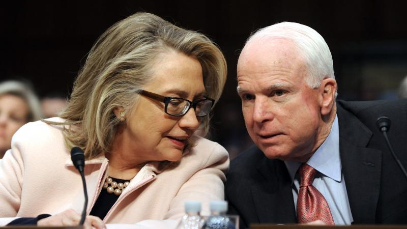 Hillary Clinton confers with Republican Sen. John McCain in 2013. Hillary Clinton confers with Republican Sen. John McCain in 2013.
