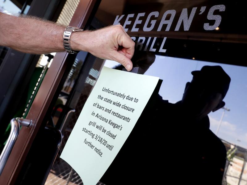 Owner Steve Johnson attaches a notice on the door of Keegan's Grill in Phoenix notifying guests his restaurant will close. Rapid shutdowns have delivered a blow to restaurants around the country. Owner Steve Johnson attaches a notice on the door of Keegan's Grill in Phoenix notifying guests his restaurant will close. Rapid shutdowns have delivered a blow to restaurants around the country.