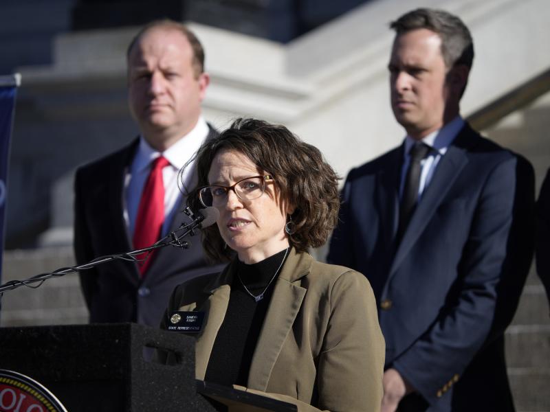 Colorado Governor Jared Polis, back left, and Colorado Senate Majority Leader Steve Fenberg, back right, listen as Majority Leader Daneya Esgar speaks during a news conference. Esgar has called for the U.S. Supreme Court to uphold Roe v. Wade. Colorado Governor Jared Polis, back left, and Colorado Senate Majority Leader Steve Fenberg, back right, listen as Majority Leader Daneya Esgar speaks during a news conference. Esgar has called for the U.S. Supreme Court to uphold Roe v. Wade.