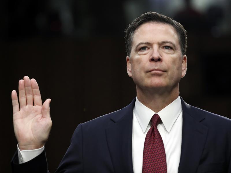 Former FBI director James Comey is sworn in during a Senate Intelligence Committee hearing on Capitol Hill, in June 2017. Former FBI director James Comey is sworn in during a Senate Intelligence Committee hearing on Capitol Hill, in June 2017.