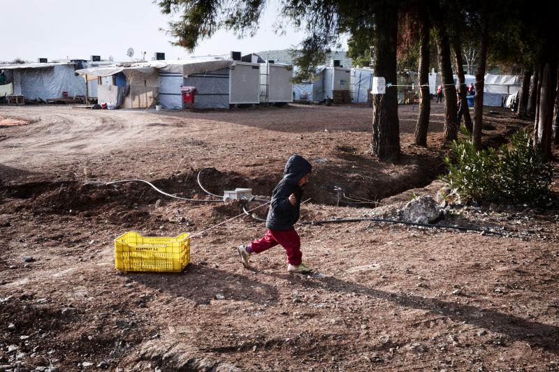 A child drags a crate at a refugee camp for Syrians and Kurds north of Athens. Children under age 14 make up nearly half of the Syrian refugees resettled in the U.S. A child drags a crate at a refugee camp for Syrians and Kurds north of Athens. Children under age 14 make up nearly half of the Syrian refugees resettled in the U.S.