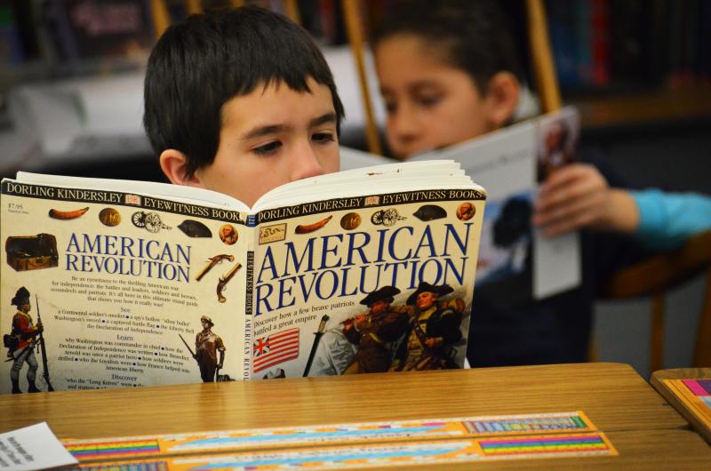 Fourth-grader Isiah Soto digests some history during independent reading time. Fourth-grader Isiah Soto digests some history during independent reading time.