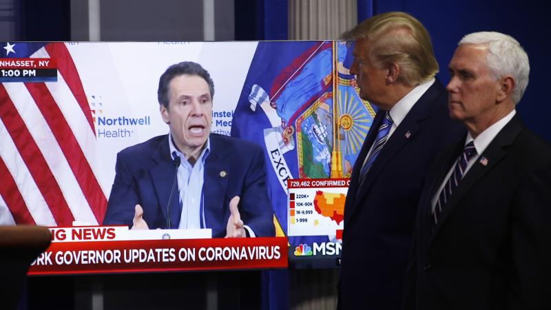 Some 78% of New York voters say they trust Gov. Andrew Cuomo to decide when to reopen their state, compared to 16% who say they trust President Trump. Here, Trump and Vice President Mike Pence watch a video of Cuomo speaking, during a coronavirus task for Some 78% of New York voters say they trust Gov. Andrew Cuomo to decide when to reopen their state, compared to 16% who say they trust President Trump. Here, Trump and Vice President Mike Pence watch a video of Cuomo speaking, during a coronavirus task for