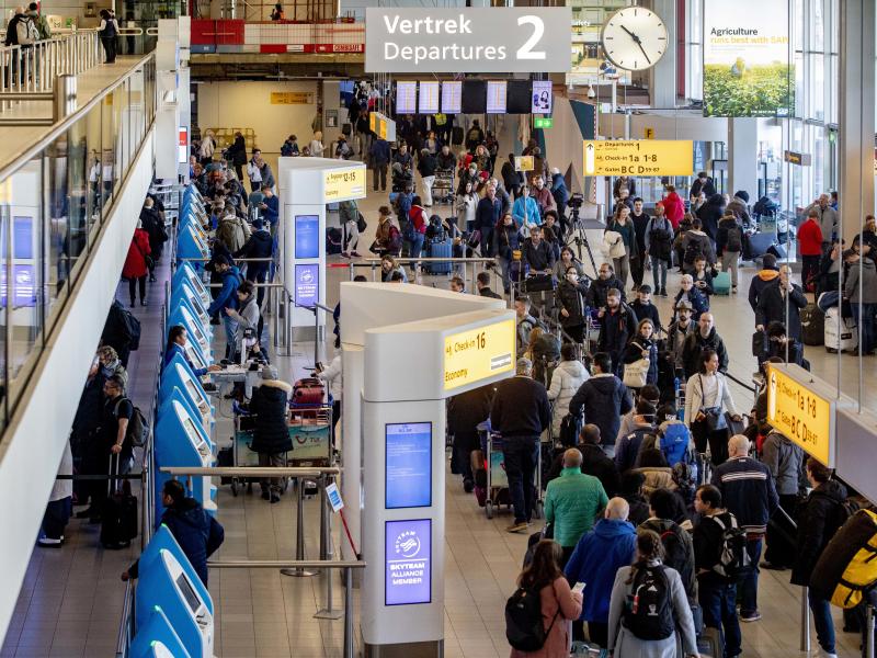 Passengers hoping to change their flights to the U.S. wait in long lines at Amsterdam Airport Schiphol in the Netherlands after President Trump announced new restrictions on travel from Europe. Passengers hoping to change their flights to the U.S. wait in long lines at Amsterdam Airport Schiphol in the Netherlands after President Trump announced new restrictions on travel from Europe.