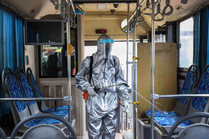 A worker disinfects the inside of a bus in Addis Ababa, Ethiopia. Transit agencies are taking new steps to reduce the risks for riders during the pandemic. A worker disinfects the inside of a bus in Addis Ababa, Ethiopia. Transit agencies are taking new steps to reduce the risks for riders during the pandemic.