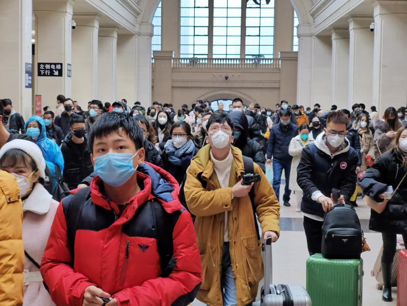 People wear face masks as they wait at Hankou Railway Station earlier this week in Wuhan, China. Experts say there is little evidence that masks prevent infection. People wear face masks as they wait at Hankou Railway Station earlier this week in Wuhan, China. Experts say there is little evidence that masks prevent infection.