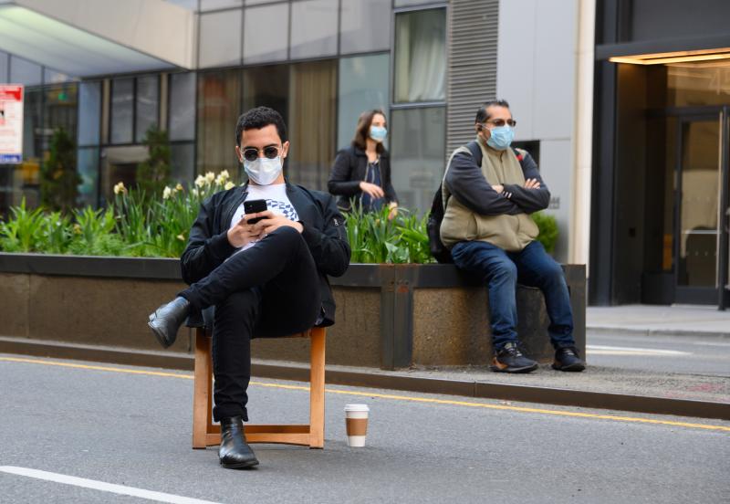 New Yorkers on Manhattan's Park Avenue cover their faces last week. New Yorkers on Manhattan's Park Avenue cover their faces last week.