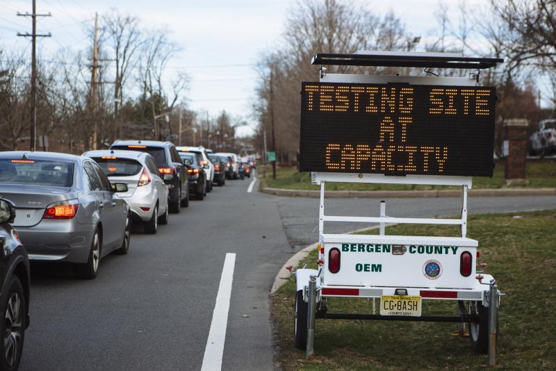 People wait in their vehicles for coronavirus testing at Bergen Community College in Paramus, N.J., last month. People wait in their vehicles for coronavirus testing at Bergen Community College in Paramus, N.J., last month.