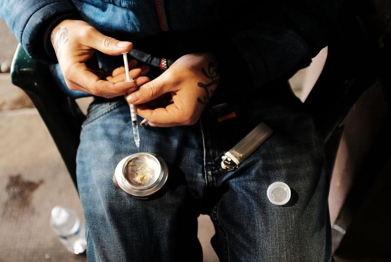 A young man uses heroin under a bridge in the Kensington section of Philadelphia, a neighborhood that has become a hub for heroin use. The economic costs of the epidemic are mounting, researchers say, as the U.S. loses more and more workers in their prime A young man uses heroin under a bridge in the Kensington section of Philadelphia, a neighborhood that has become a hub for heroin use. The economic costs of the epidemic are mounting, researchers say, as the U.S. loses more and more workers in their prime