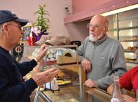 Michael Doucleff Sr. (right) talks to a longtime customer at Duke Bakery in Alton, Ill. Michael Doucleff Sr. (right) talks to a longtime customer at Duke Bakery in Alton, Ill.