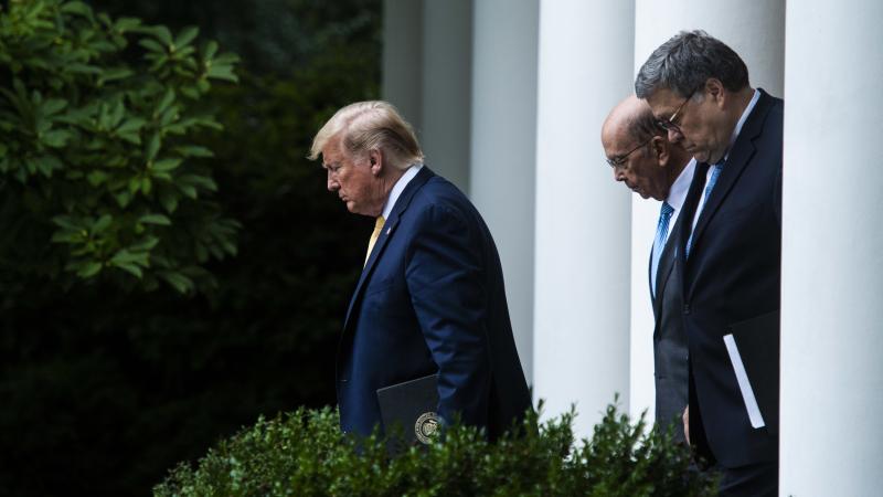 President Trump, Commerce Secretary Wilbur Ross (center) and Attorney General William Barr walk into the White House Rose Garden for a July 2019 press conference on the census. President Trump, Commerce Secretary Wilbur Ross (center) and Attorney General William Barr walk into the White House Rose Garden for a July 2019 press conference on the census.