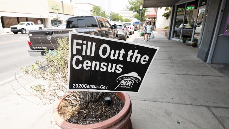 A sign promoting the 2020 census stands in a planter in Roswell, N.M., in August. A federal judge has ordered the Trump administration to continue holding off on wrapping up the census for now. A sign promoting the 2020 census stands in a planter in Roswell, N.M., in August. A federal judge has ordered the Trump administration to continue holding off on wrapping up the census for now.