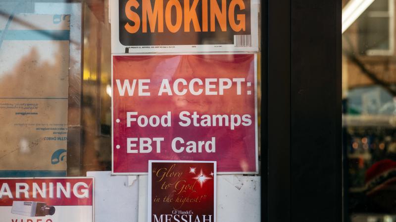 A judge has tossed out a U.S. Department of Agriculture rule that would have limited food stamps, noting that during the pandemic "SNAP rosters have grown by over 17 percent with over 6 million new enrollees." Here, a sign alerts customers about food stam A judge has tossed out a U.S. Department of Agriculture rule that would have limited food stamps, noting that during the pandemic "SNAP rosters have grown by over 17 percent with over 6 million new enrollees." Here, a sign alerts customers about food stam