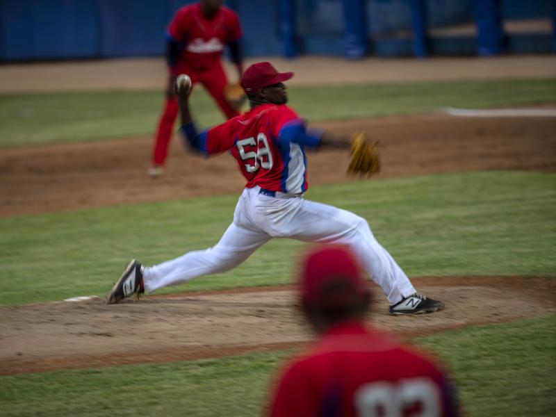 Cuba's pitcher Yoanni Yera Montalvo throws the ball during a training session at the Estadio Latinoamericano in Havana last month. Cuba's losses this week in Florida to Venezuela and Canada in Olympic baseball qualifying play means the team will not compe Cuba's pitcher Yoanni Yera Montalvo throws the ball during a training session at the Estadio Latinoamericano in Havana last month. Cuba's losses this week in Florida to Venezuela and Canada in Olympic baseball qualifying play means the team will not compe