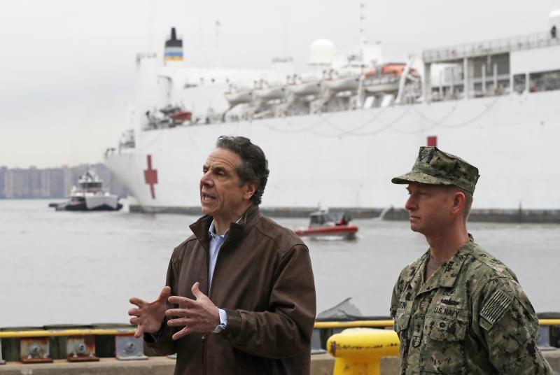 New York Gov. Andrew Cuomo, left, speaks after the arrival of the USNS Comfort, a naval hospital ship with a 1,000 bed-capacity. New York Gov. Andrew Cuomo, left, speaks after the arrival of the USNS Comfort, a naval hospital ship with a 1,000 bed-capacity.
