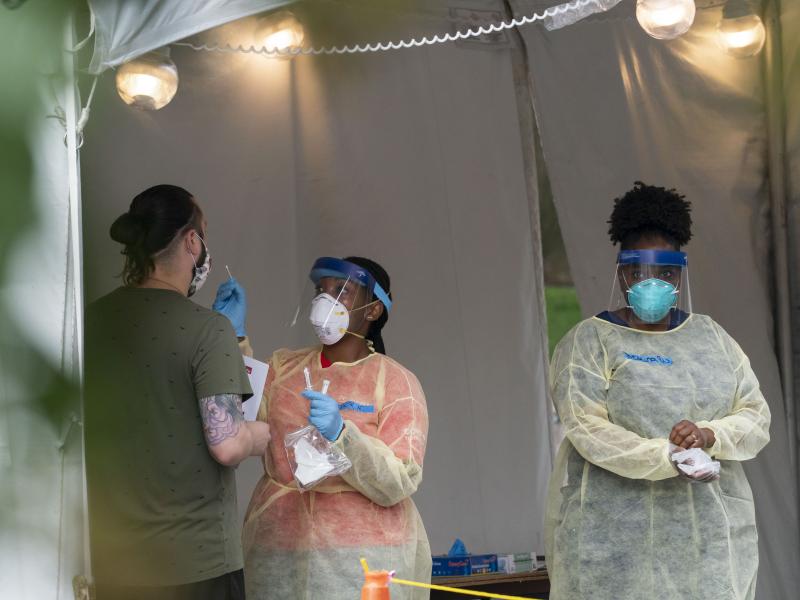 A nurse with the Washington, D.C. Dept. of Health is shown administering a coronavirus test last month. D.C. is now seeing a spike in demand for testing. A nurse with the Washington, D.C. Dept. of Health is shown administering a coronavirus test last month. D.C. is now seeing a spike in demand for testing.