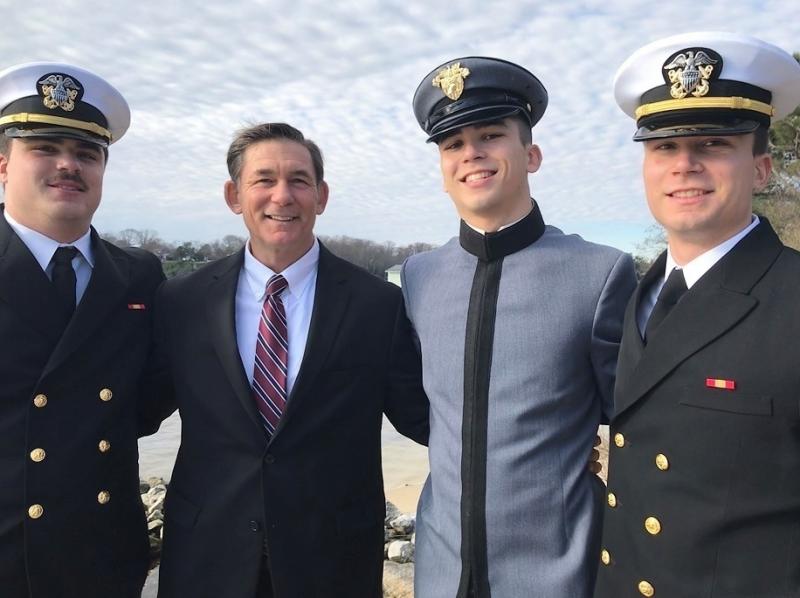 Jeff Nelligan (center left) stands with his three sons in December 2019. Jeff Nelligan (center left) stands with his three sons in December 2019.