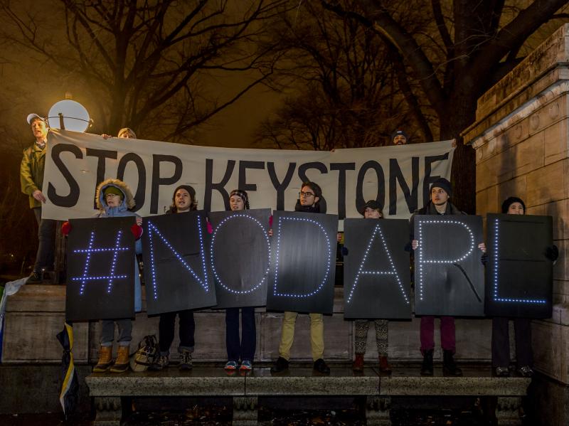 Hundreds of New Yorkers gathered at Columbus Circle in New York for a protest march to Trump Tower after the president signed an order to advance the Keystone XL and Dakota Access pipelines. Hundreds of New Yorkers gathered at Columbus Circle in New York for a protest march to Trump Tower after the president signed an order to advance the Keystone XL and Dakota Access pipelines.