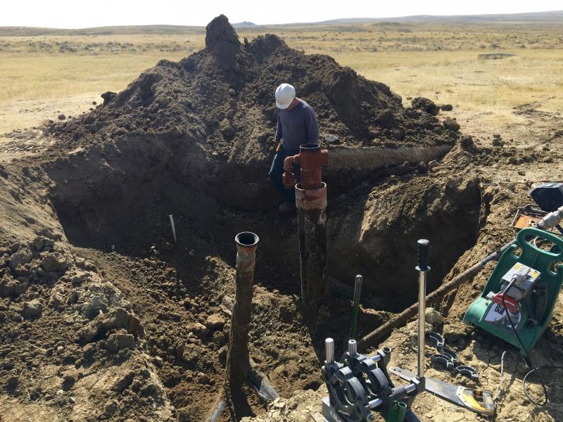 A contractor prepares to cut off the top of a coal bed methane well near Gillette, Wyo., in 2015. It's one of thousands of abandoned, plugged wells sprinkled throughout Wyoming and Colorado. A contractor prepares to cut off the top of a coal bed methane well near Gillette, Wyo., in 2015. It's one of thousands of abandoned, plugged wells sprinkled throughout Wyoming and Colorado.