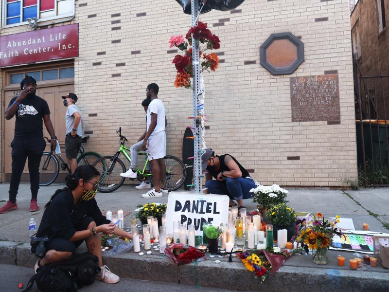 A memorial, pictured in Sept. 2020, commemorated the site where Daniel Prude was arrested in Rochester, N.Y. Prude died of asphyxiation after being restrained by police in March, and his family has filed a wrongful death lawsuit nearly a year later. A memorial, pictured in Sept. 2020, commemorated the site where Daniel Prude was arrested in Rochester, N.Y. Prude died of asphyxiation after being restrained by police in March, and his family has filed a wrongful death lawsuit nearly a year later.
