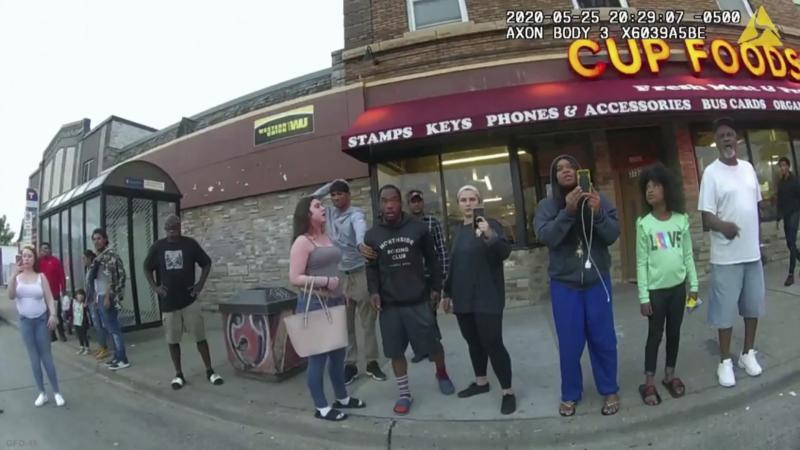 A police body camera image shows bystanders including Darnella Frazier (third from right filming) as former Minneapolis police officer Derek Chauvin was recorded pressing his knee on George Floyd's neck in Minneapolis. A police body camera image shows bystanders including Darnella Frazier (third from right filming) as former Minneapolis police officer Derek Chauvin was recorded pressing his knee on George Floyd's neck in Minneapolis.