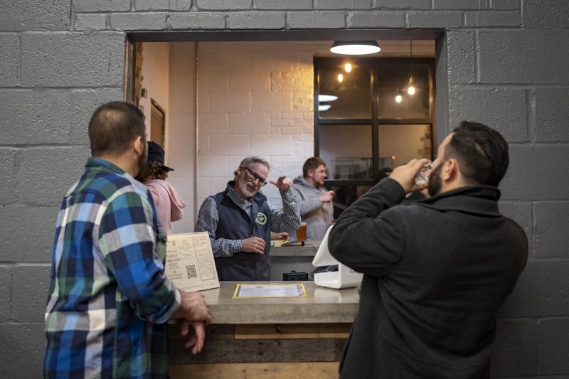 Co-founder Mark Burke signs with patrons at Streetcar 82 Brewing Co., in Hyattsville, Md. "My goal is to make the best beer," Burke said. "But the impact and magnitude of how this influences the Deaf community is inspiring." Co-founder Mark Burke signs with patrons at Streetcar 82 Brewing Co., in Hyattsville, Md. "My goal is to make the best beer," Burke said. "But the impact and magnitude of how this influences the Deaf community is inspiring."