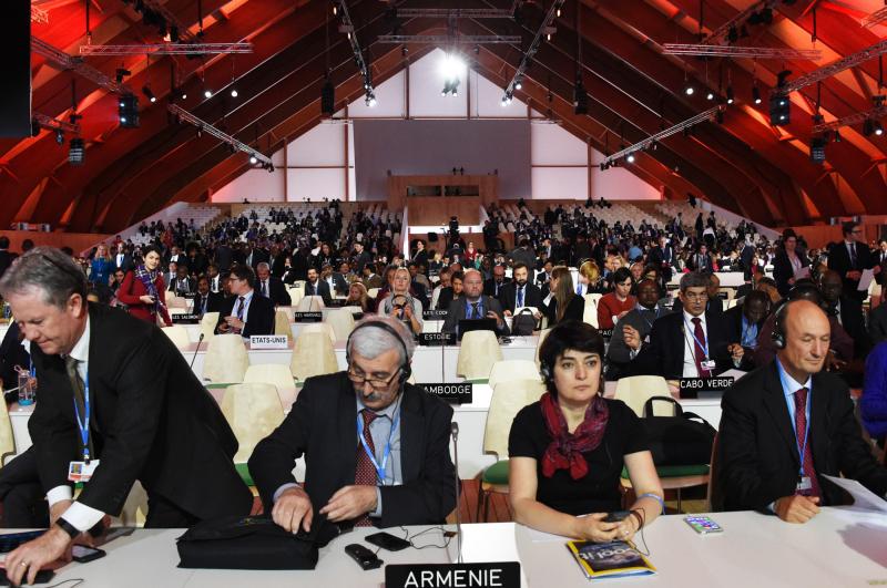 Delegates attend a plenary session at the COP21 United Nations Climate Conference. Delegates attend a plenary session at the COP21 United Nations Climate Conference.