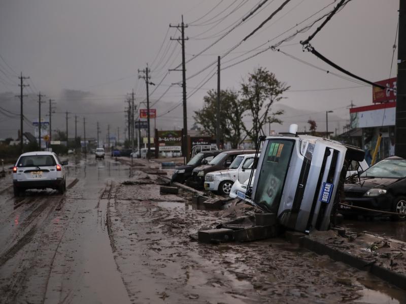 Typhoon Hagibis left overturned cars and mud-slicked streets in Hoyasu, Japan. Rescue crews are still combing through areas that flooded after extreme rain caused rivers to break through levees. Typhoon Hagibis left overturned cars and mud-slicked streets in Hoyasu, Japan. Rescue crews are still combing through areas that flooded after extreme rain caused rivers to break through levees.
