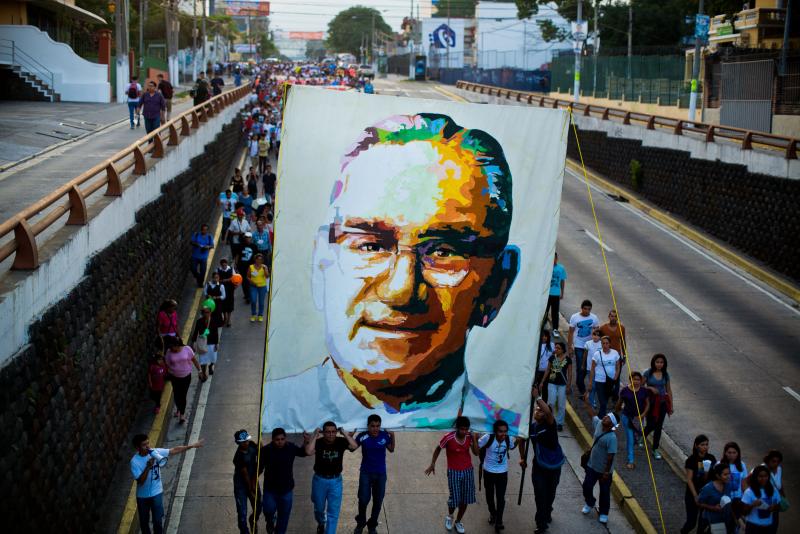 Catholics march in San Salvador on March 22, 2014, during the commemoration of the 33th anniversary of Romero's murder. Catholics march in San Salvador on March 22, 2014, during the commemoration of the 33th anniversary of Romero's murder.