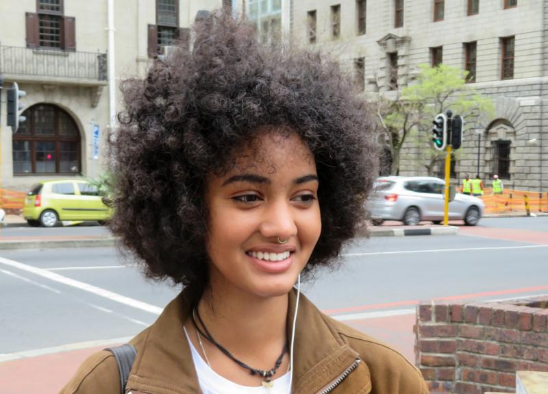 Zia Simpson, a student and sales assistant in Cape Town, says even her father tells her to tame her Afro. "That generation fought against apartheid, but they still carry around the mentality that green eyes look better on a person, that straight hair look Zia Simpson, a student and sales assistant in Cape Town, says even her father tells her to tame her Afro. "That generation fought against apartheid, but they still carry around the mentality that green eyes look better on a person, that straight hair look