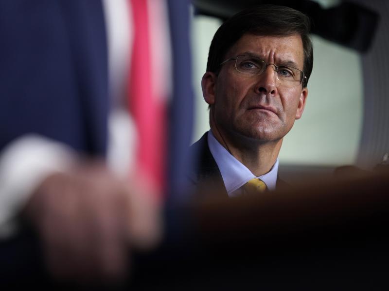Defense Secretary Mark Esper listens as President Trump speaks during a news briefing with the Coronavirus Task Force at the White House on last week. Defense Secretary Mark Esper listens as President Trump speaks during a news briefing with the Coronavirus Task Force at the White House on last week.