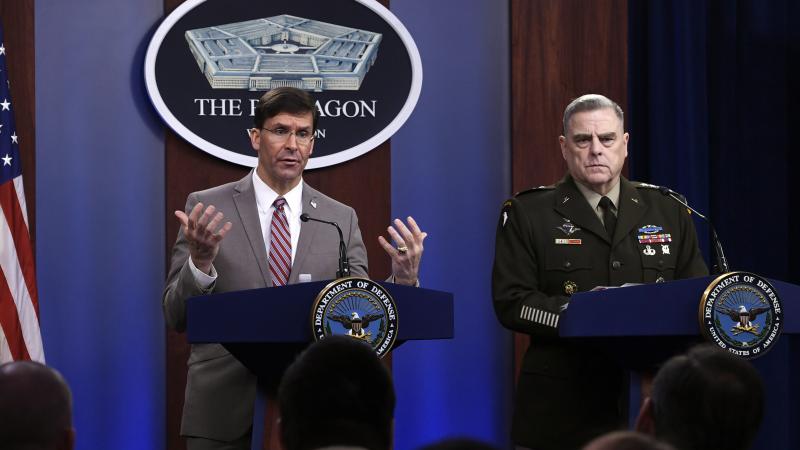 Defense Secretary Mark Esper (left) speaks as Chairman of the Joint Chiefs of Staff Army Gen. Mark Milley listens during a briefing at the Pentagon on Monday. Defense Secretary Mark Esper (left) speaks as Chairman of the Joint Chiefs of Staff Army Gen. Mark Milley listens during a briefing at the Pentagon on Monday.