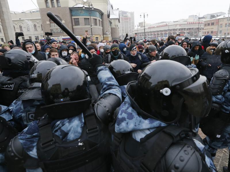 Demonstrators in Moscow clash with police Sunday during a protest against the jailing of Alexei Navalny. Thousands of people took to the streets across Russia to demand the opposition leader's release. Demonstrators in Moscow clash with police Sunday during a protest against the jailing of Alexei Navalny. Thousands of people took to the streets across Russia to demand the opposition leader's release.
