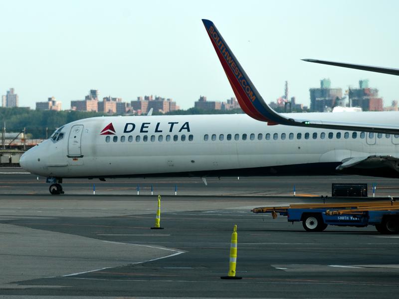 A Delta jet taxis on the tarmac at New York's LaGuardia Airport. About 1,000 Delta flights around the globe were canceled Monday, and hundreds more on Tuesday, after a system outage. A Delta jet taxis on the tarmac at New York's LaGuardia Airport. About 1,000 Delta flights around the globe were canceled Monday, and hundreds more on Tuesday, after a system outage.