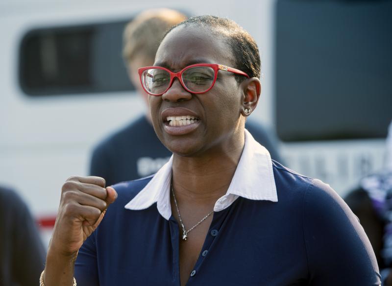 Nina Turner, a candidate running in a special Democratic primary for Ohio's 11th Congressional District, speaks with supporters near the Cuyahoga County Board of Elections in Cleveland before casting her early vote on July 7. Nina Turner, a candidate running in a special Democratic primary for Ohio's 11th Congressional District, speaks with supporters near the Cuyahoga County Board of Elections in Cleveland before casting her early vote on July 7.