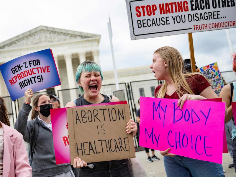 Young people who support access to abortion chant in front of un-scalable fence that stands around the US Supreme Court in Washington, DC, on May 5, 2022. Young people who support access to abortion chant in front of un-scalable fence that stands around the US Supreme Court in Washington, DC, on May 5, 2022.