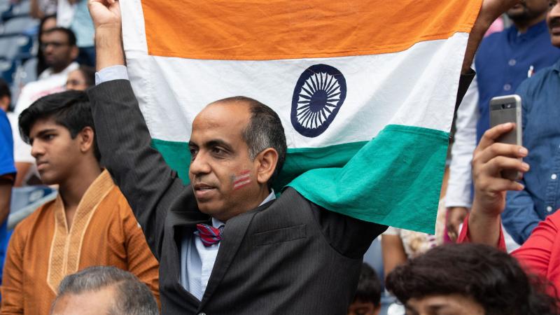 A man holds up an Indian flag during a rally with President Trump and Prime Minister Modi in Houston in September 2019. Trump and Modi have spoken of their friendship, but most Indian Americans say U.S.-India ties are low on their political priorities. A man holds up an Indian flag during a rally with President Trump and Prime Minister Modi in Houston in September 2019. Trump and Modi have spoken of their friendship, but most Indian Americans say U.S.-India ties are low on their political priorities.
