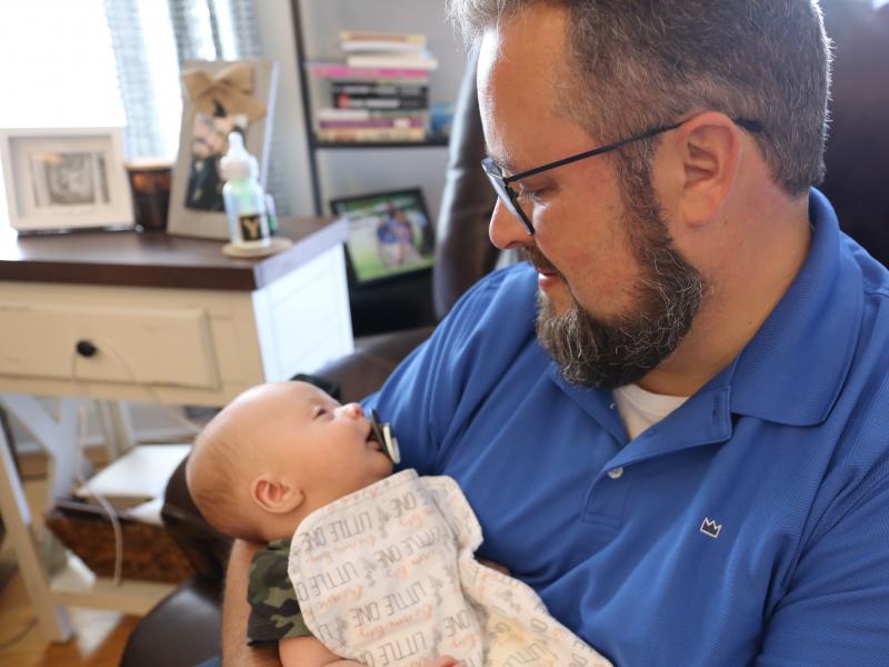 Scott Baisley holds his son Sullivan, who was delivered shortly before his mother died of COVID-19. Scott Baisley holds his son Sullivan, who was delivered shortly before his mother died of COVID-19.