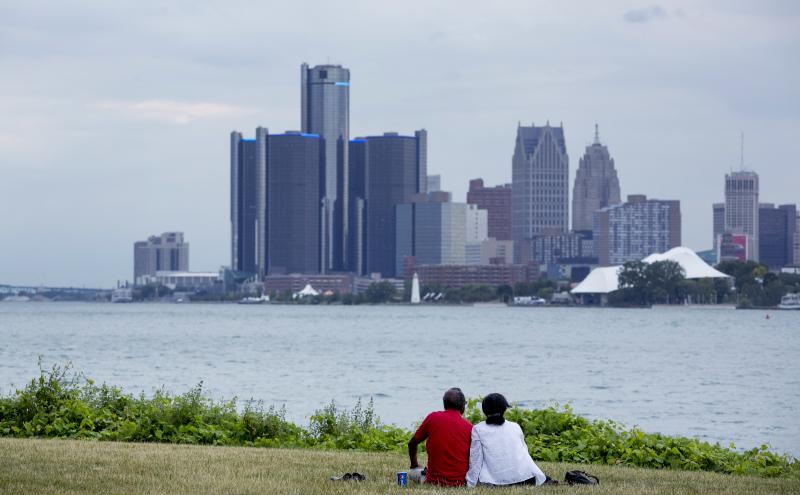 A couple sits on Belle Isle while looking at the skyline in Detroit, Michigan, in 2017. The city has been released from state oversight of its finances after several years of scrutiny. A couple sits on Belle Isle while looking at the skyline in Detroit, Michigan, in 2017. The city has been released from state oversight of its finances after several years of scrutiny.