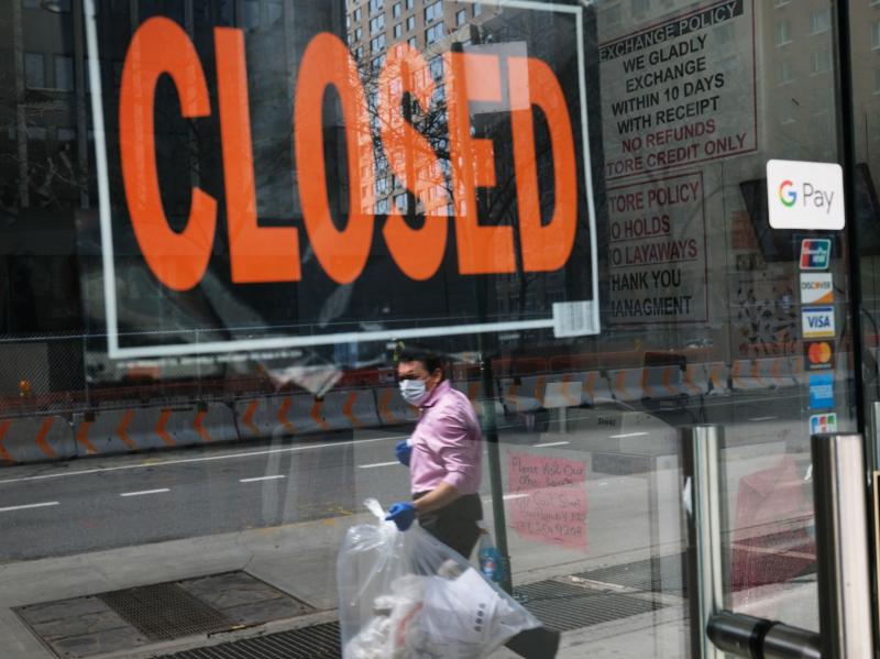 A closed sign is displayed in the window of a business in a nearly deserted lower Manhattan on April 17, 2020, in New York. Many small businesses benefited from a government emergency loan program during the pandemic, but its effectiveness is still in dou A closed sign is displayed in the window of a business in a nearly deserted lower Manhattan on April 17, 2020, in New York. Many small businesses benefited from a government emergency loan program during the pandemic, but its effectiveness is still in dou