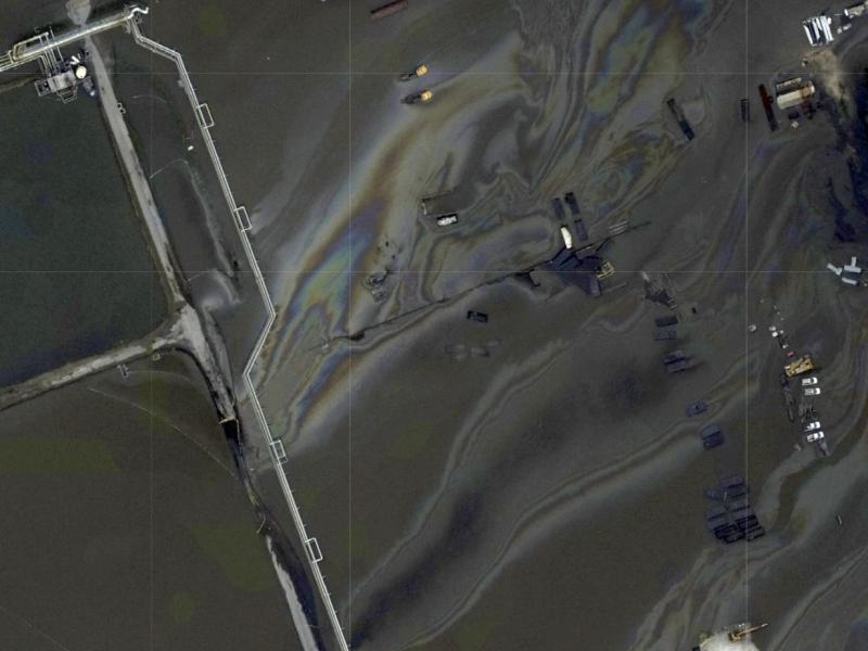 This image provided by NOAA taken Tuesday, Aug. 31, 2021 and reviewed by The Associated Press shows oil slicks at the flooded Phillips 66 Alliance Refinery in Belle Chasse, La. It's just one of the oil spills being looked into in the Gulf region in the af This image provided by NOAA taken Tuesday, Aug. 31, 2021 and reviewed by The Associated Press shows oil slicks at the flooded Phillips 66 Alliance Refinery in Belle Chasse, La. It's just one of the oil spills being looked into in the Gulf region in the af