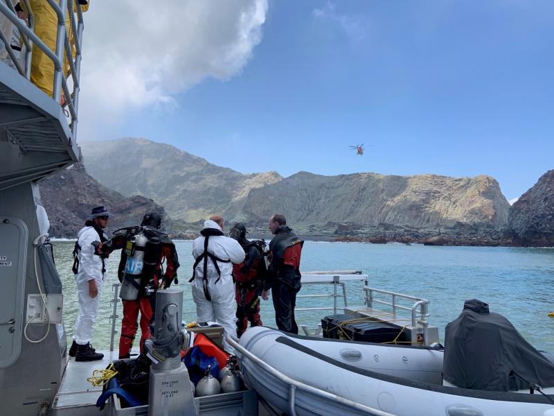 Divers near New Zealand's White Island search for a body after the volcanic eruption earlier this week. Divers near New Zealand's White Island search for a body after the volcanic eruption earlier this week.