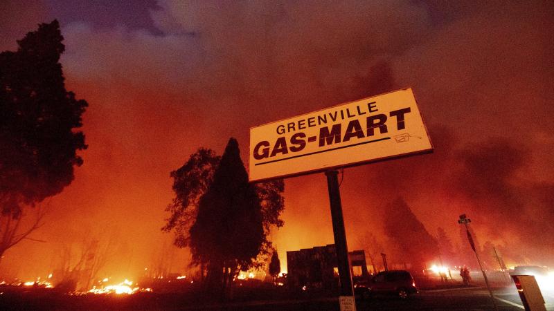 Flames consume buildings as the Dixie Fire tears through the Greenville community of Plumas County, Calif., on Aug. 4, 2021. Flames consume buildings as the Dixie Fire tears through the Greenville community of Plumas County, Calif., on Aug. 4, 2021.