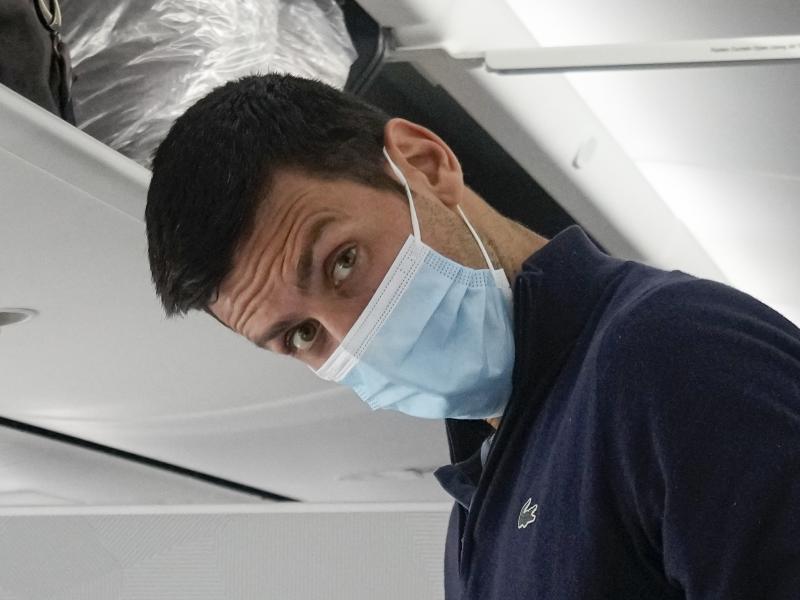 Novak Djokovic prepares to take his seat on a plane to Belgrade, in Dubai, United Arab Emirates, Monday, Jan. 17, 2022. Novak Djokovic prepares to take his seat on a plane to Belgrade, in Dubai, United Arab Emirates, Monday, Jan. 17, 2022.