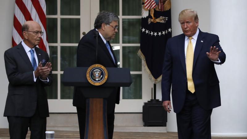 President Trump is joined by Commerce Secretary Wilbur Ross (left) and Attorney General William Barr during a July event at the White House announcing that his administration is relying on federal agency records to produce citizenship data. President Trump is joined by Commerce Secretary Wilbur Ross (left) and Attorney General William Barr during a July event at the White House announcing that his administration is relying on federal agency records to produce citizenship data.