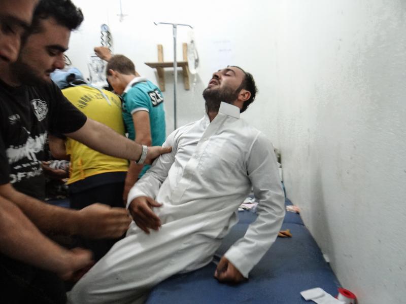 Health workers treat a man at a hospital in Idlib, Syria, about 40 miles from Aleppo. Health workers treat a man at a hospital in Idlib, Syria, about 40 miles from Aleppo.