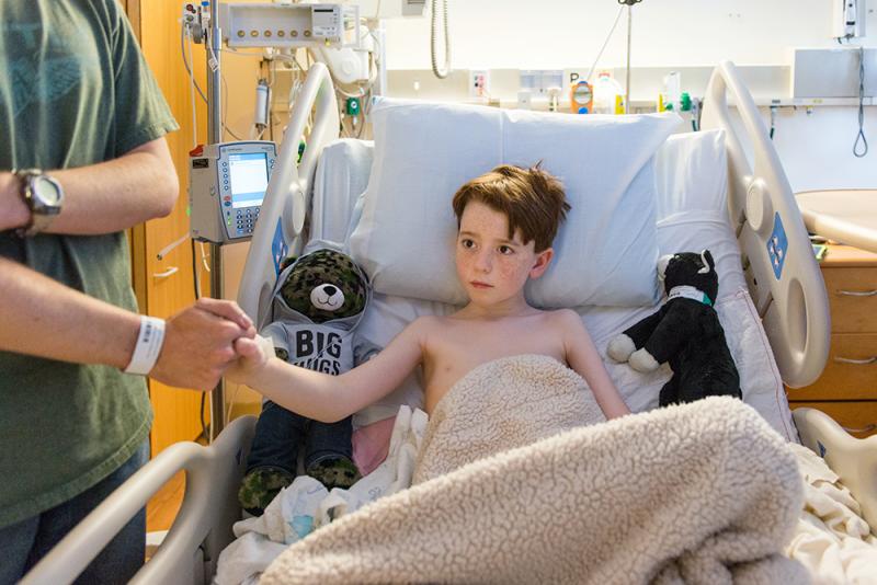 Ten-year-old Matthew Husby gets some low-tech comfort from his father after surgery at Lucile Packard Children's Hospital Stanford in Palo Alto, Calif. Ten-year-old Matthew Husby gets some low-tech comfort from his father after surgery at Lucile Packard Children's Hospital Stanford in Palo Alto, Calif.