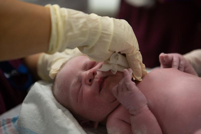 Evelyn Marie Vukadinovich is swabbed with a gauze pad immediately after being born by cesarean section at Inova Women's Hospital in Falls Church, Va. Evelyn Marie Vukadinovich is swabbed with a gauze pad immediately after being born by cesarean section at Inova Women's Hospital in Falls Church, Va.