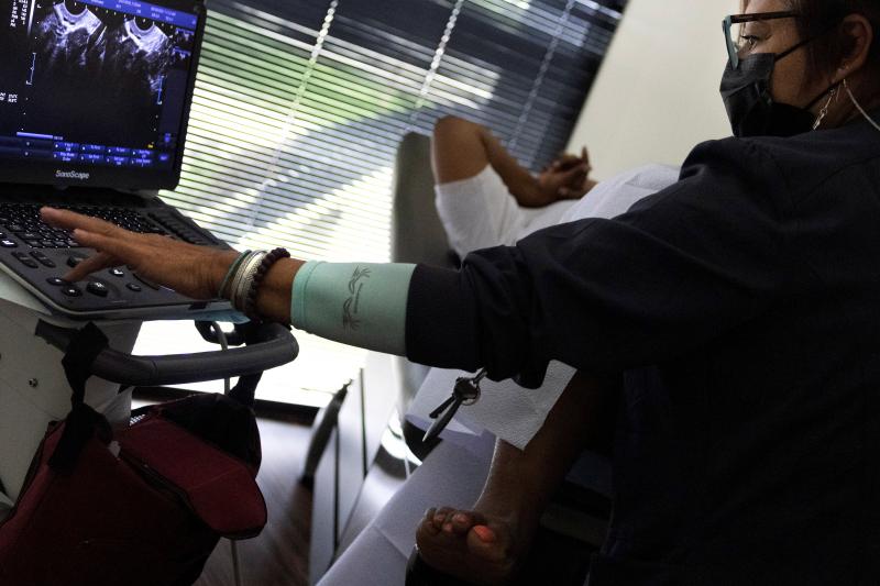 Glenda Lima, a surgical tech at Houston Women's Reproductive Services, performs an ultrasound on a patient on Sept. 30, 2021. The patient drove to the clinic from Louisiana and the ultrasound was to determine whether the woman is less than six weeks pregn Glenda Lima, a surgical tech at Houston Women's Reproductive Services, performs an ultrasound on a patient on Sept. 30, 2021. The patient drove to the clinic from Louisiana and the ultrasound was to determine whether the woman is less than six weeks pregn